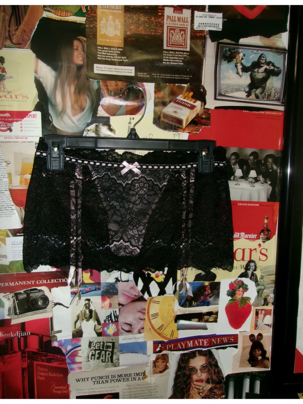 Victoria’s Secret black lace skirt with pink thong garter